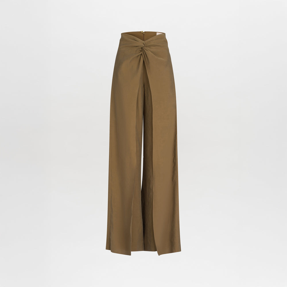 The Canturipe Pant by SVT DESIGNS is a high-waisted, wide-leg style made from premium Italian fabric, featuring a striking front knot at the waistband and shown against a plain white background.