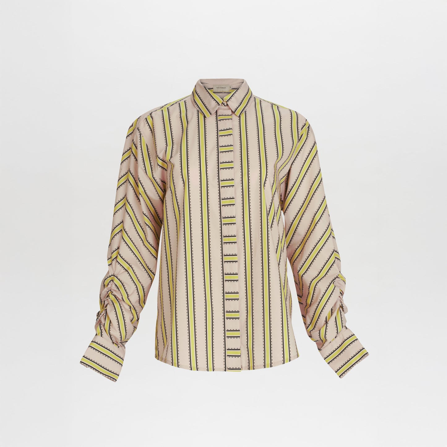 The Caritina Blouse by SVT DESIGNS is a 100% cotton, long-sleeve top with a pointed collar, vertical stripes in beige, yellow, black, and green, and slightly gathered cuffs. Shown on a plain white background.