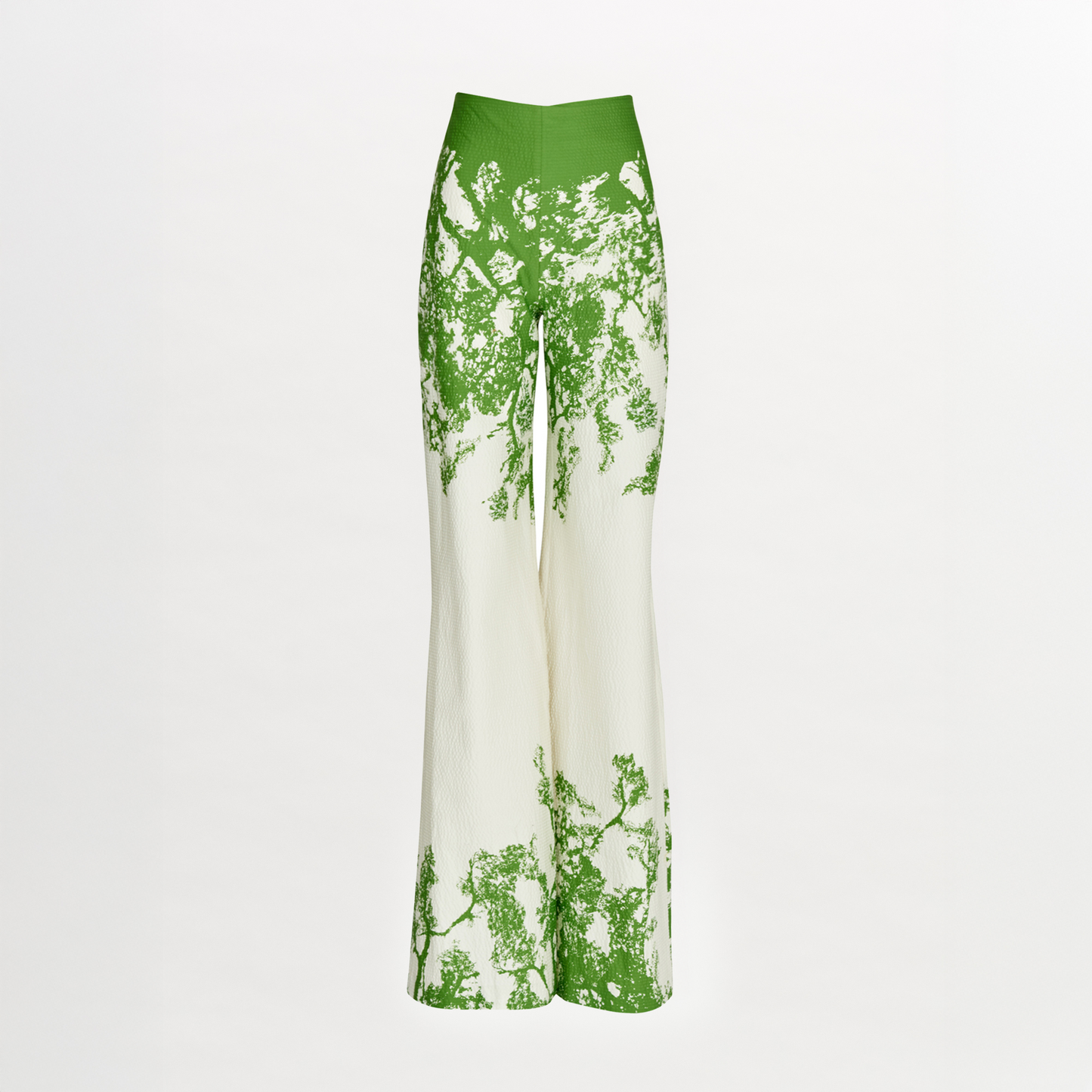 The Silvia Tcherassi Como Pant is a high-waisted, wide-leg style with a green nature-inspired print evoking tree branches, shown on a plain white background. It’s from the Resort 2024 collection.