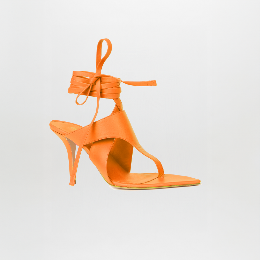 The Domenico Heels Orange by SilviaTcherassi feature Italian leather, a square toe, slim stiletto heel, and an ankle-wrap strap, shown on a plain white background.