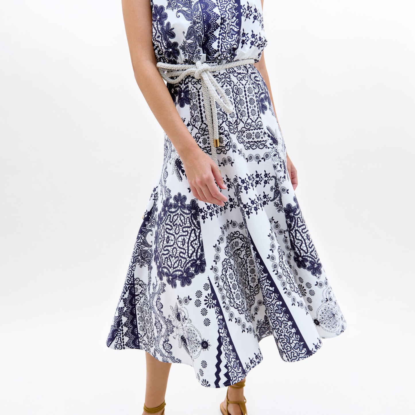 White dress with blue pattern on a white background