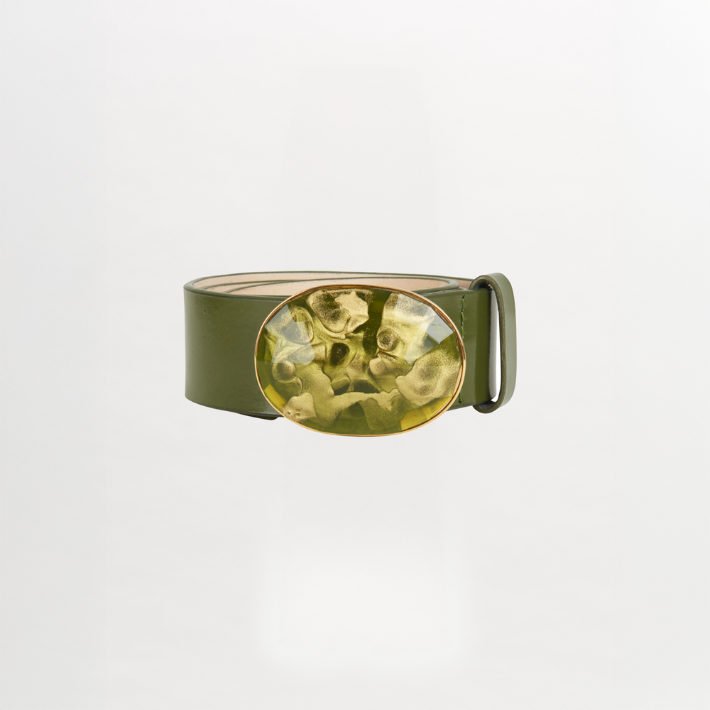 The Irene Belt Olive by Silvia Tcherassi is a standout Fall 2023 accessory—an Italian leather belt in olive green with a bold, marbled oval resin buckle, showcased against a plain white background.