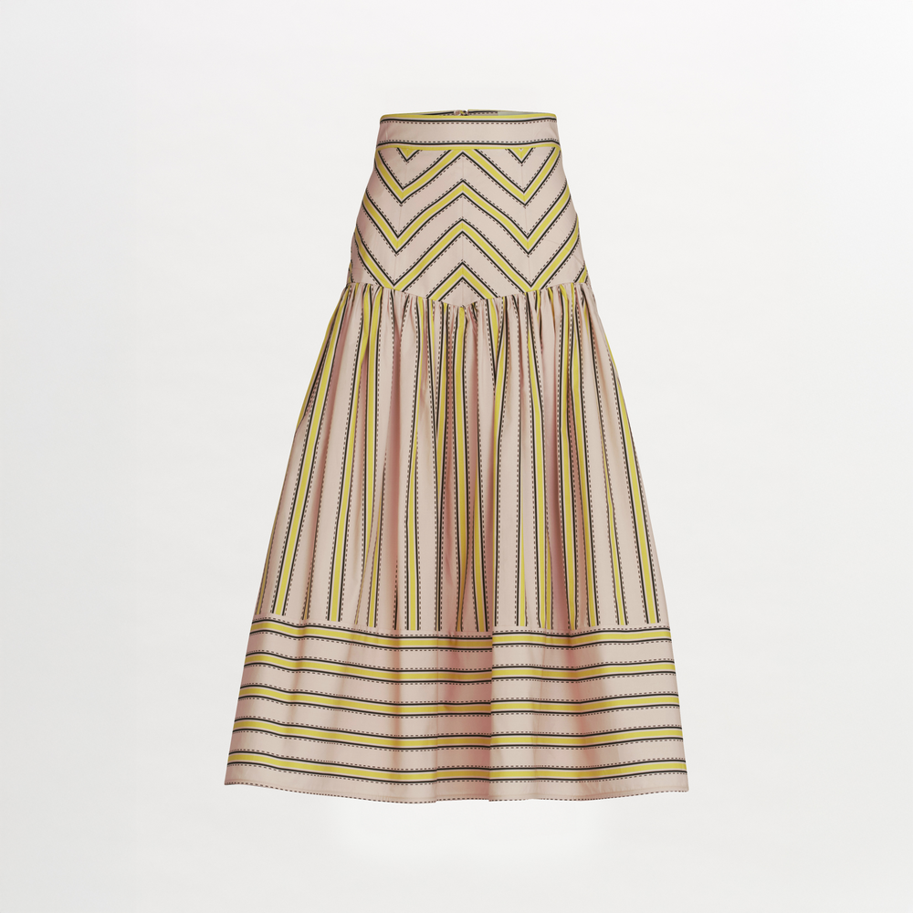 The Kristina Skirt by SVT DESIGNS is a knee-length, 100% cotton midi skirt with a flared silhouette. It features pink, yellow, and black zigzag and vertical stripes with horizontal stripes near the hem on a white background.