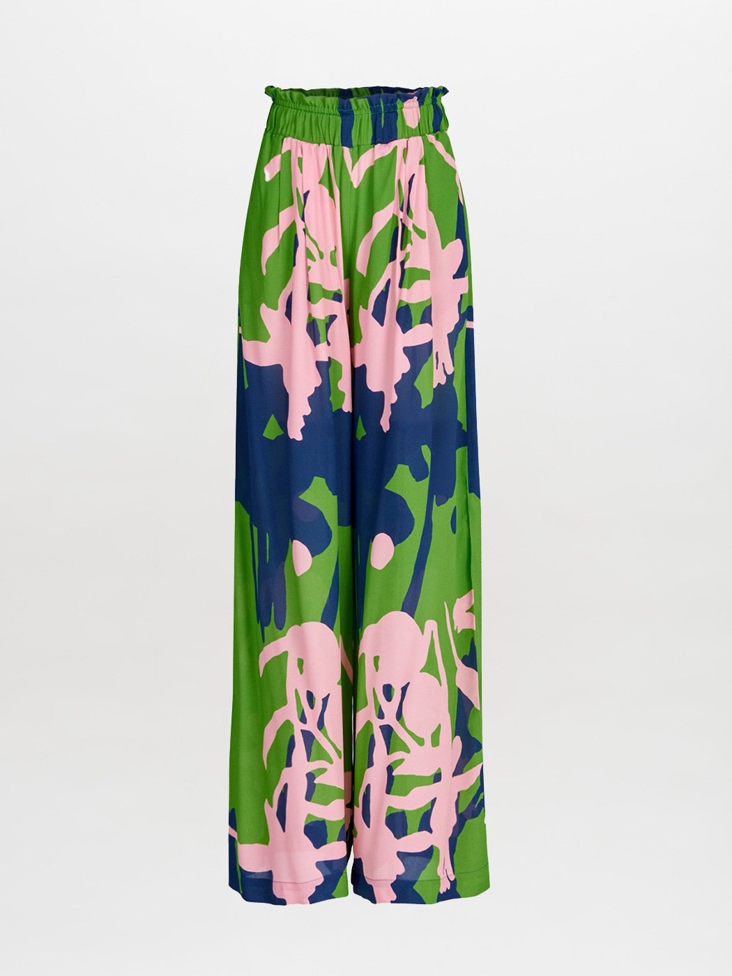 The Ovada Pant by Silvia Tcherassi features a wide-leg silhouette, high elastic waistband, and soft flannel fabric with a bold abstract green, navy blue, and light pink pattern on white.