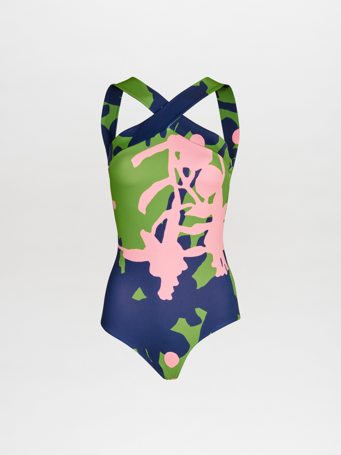 The Prato One Piece by Silvia Tcherassi showcases wide crisscross straps and an abstract pink, green, and navy print on white, set against a plain backdrop for a fresh, modern vibe.