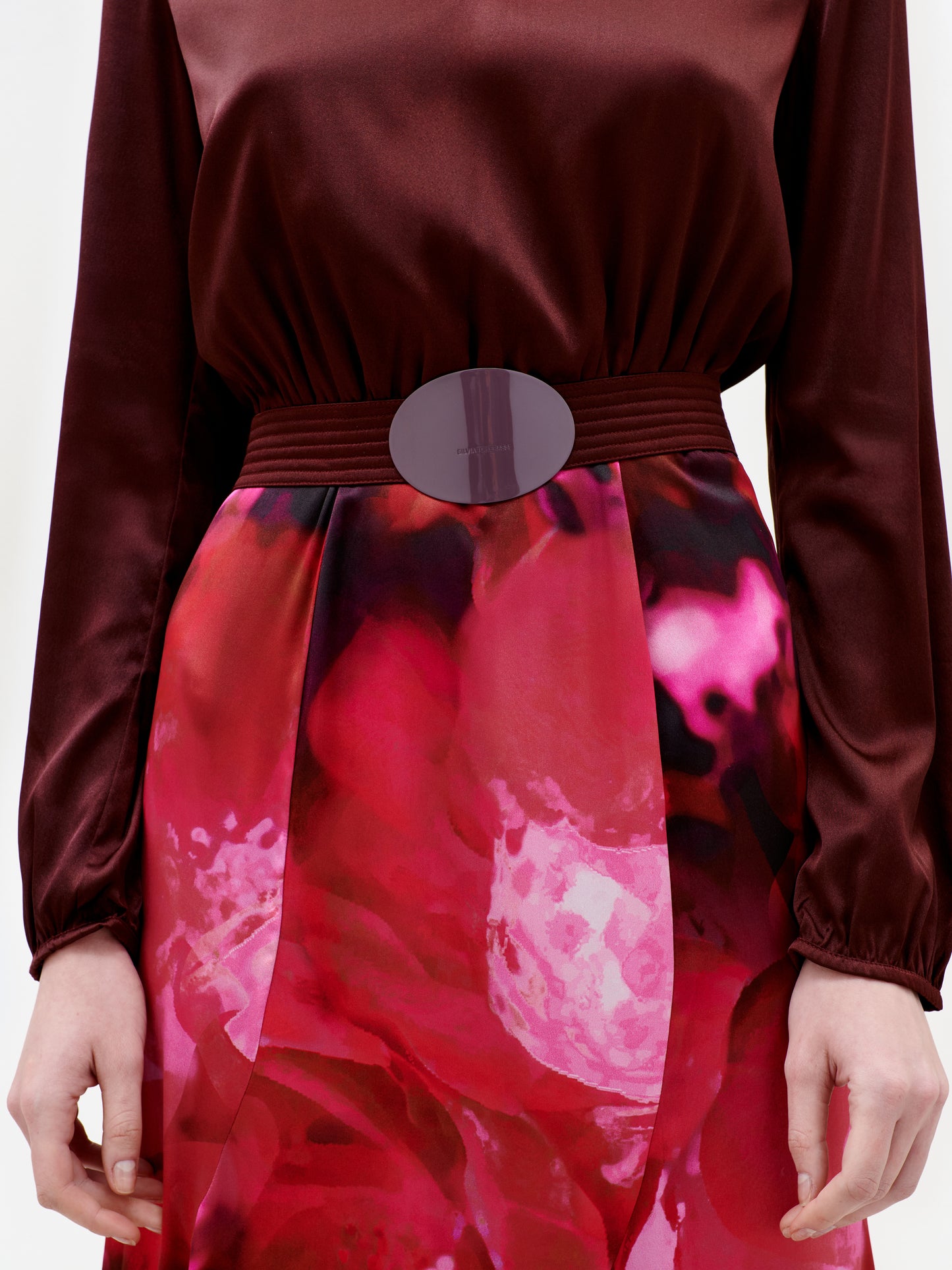 Red floral dress with a belt on a white background