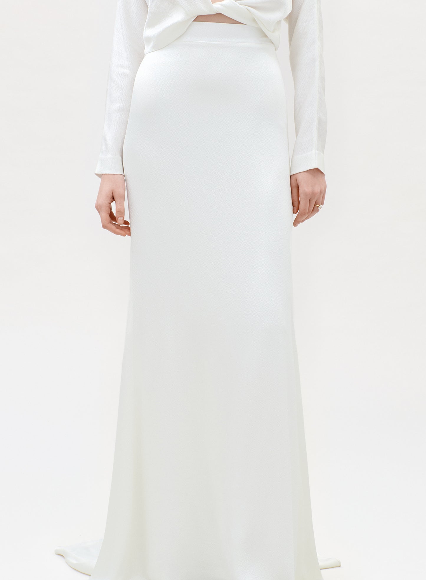 White outfit with a long skirt on a white background