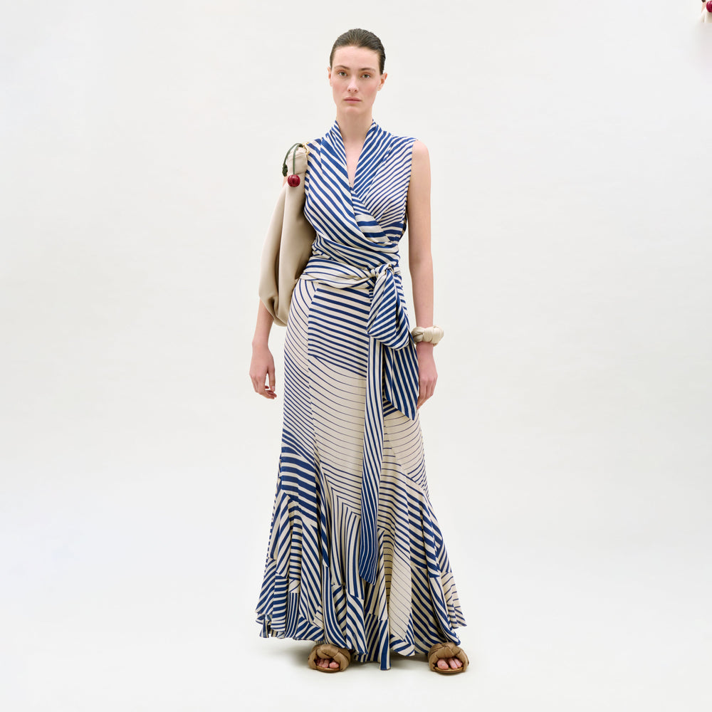 Woman wearing a blue and white striped dress on a white background