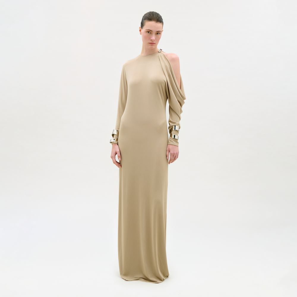 Woman wearing a beige evening gown on a white background