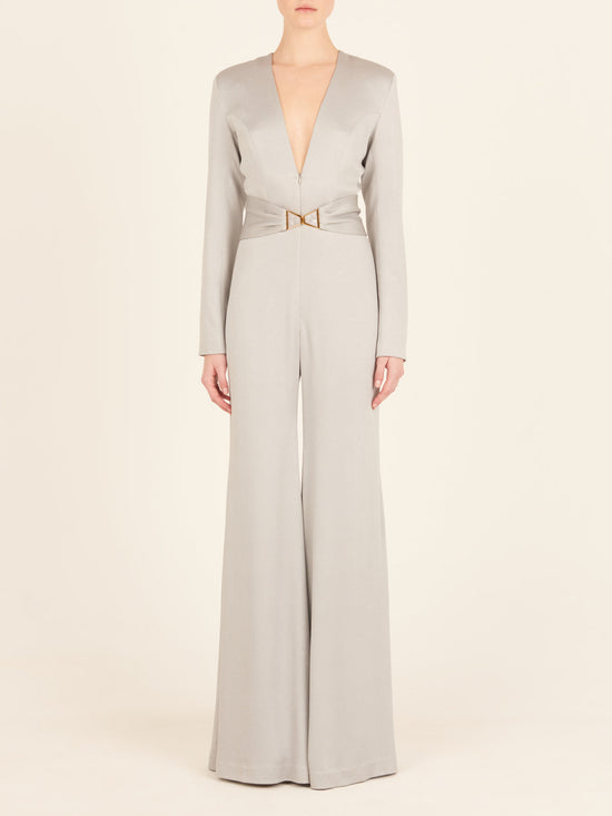 A Taboa Jumpsuit Gray with a waist-defining belt.