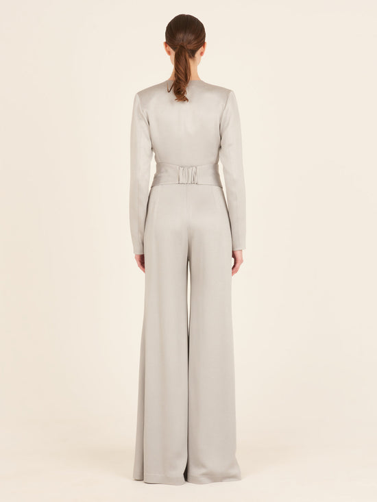 A Taboa Jumpsuit Gray with a waist-defining belt.