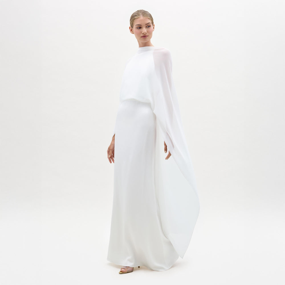 Woman wearing a white outfit on a white background