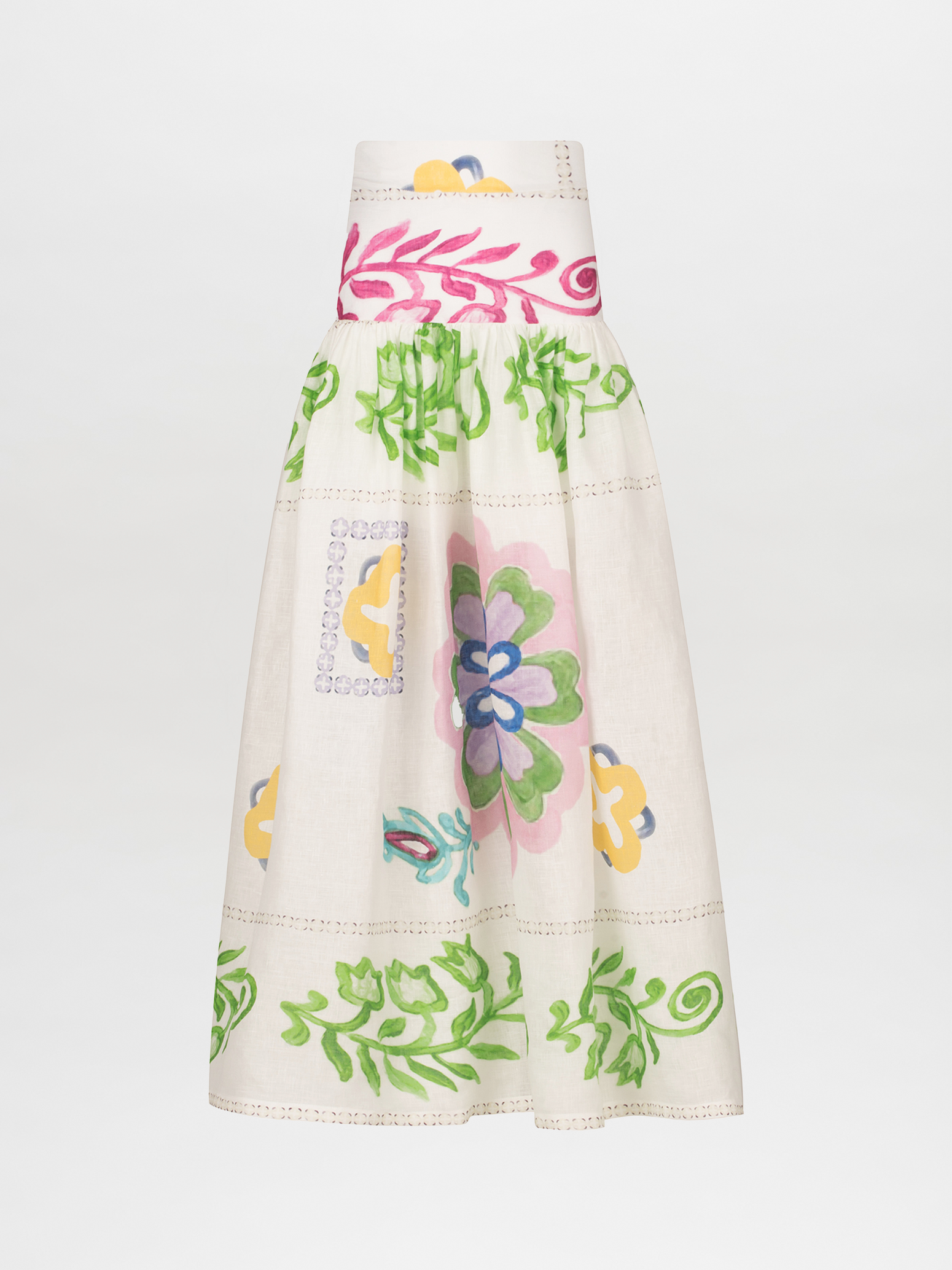 The Abla Skirt by Silvia Tcherassi US is a high-waisted, A-line linen piece featuring an abstract floral print with vibrant green leaves and multicolored pink, yellow, and blue flowers on a light background. It has a gathered waist and elegantly flows to a mid-length.