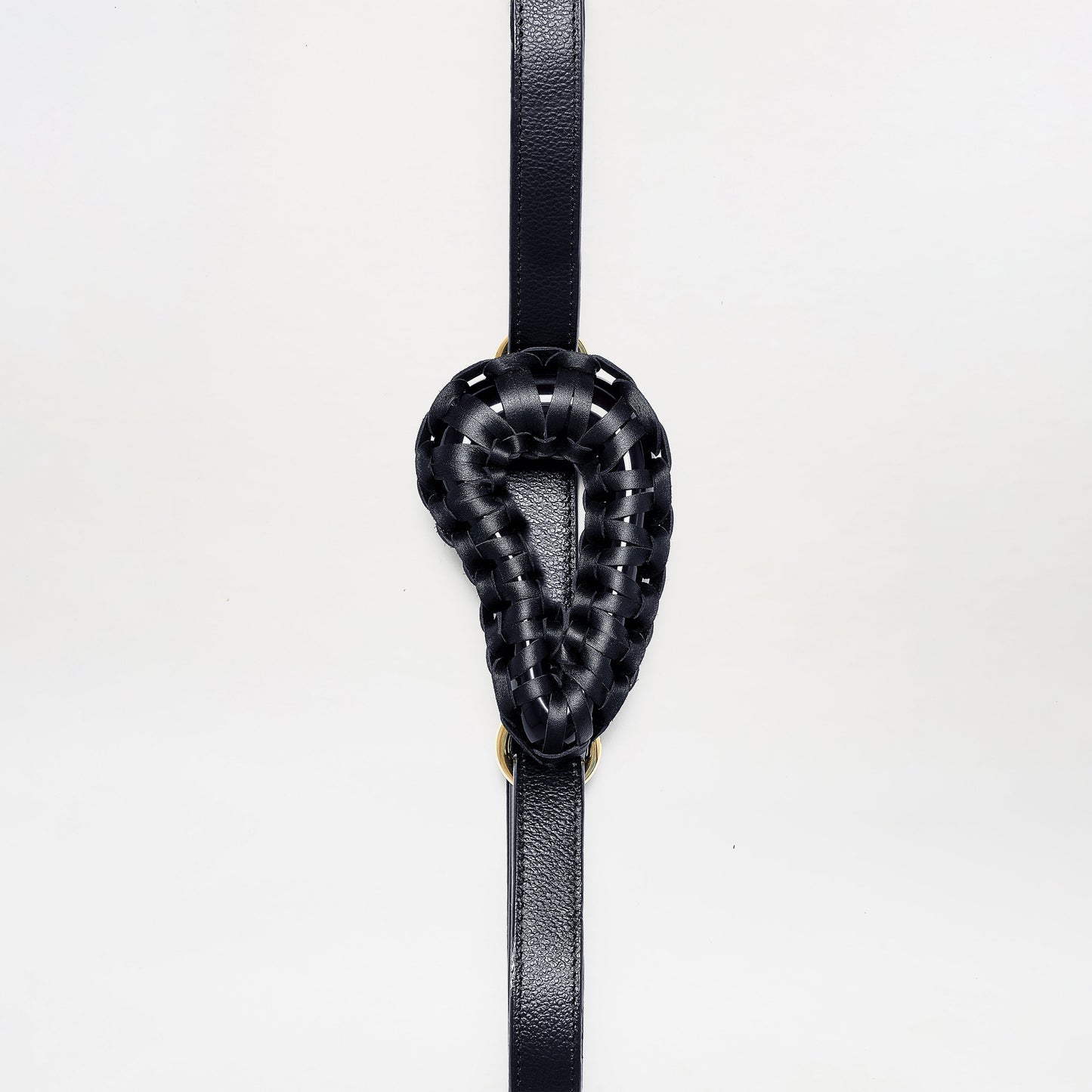 The Renata Belt features a black woven leather loop in a teardrop shape, centered on a vertical black leather strap, shown against a plain white background.