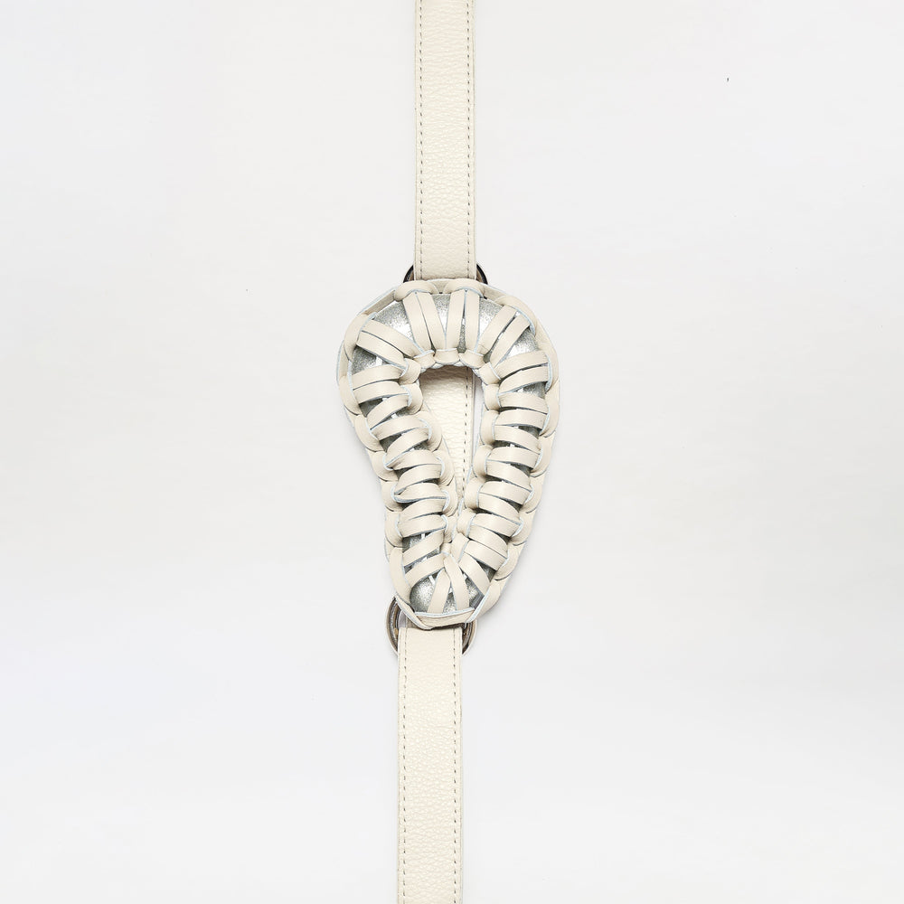 The Renata Belt is a cream-colored, intricately woven leather accessory featuring a looped oval center, shown against a plain white background.
