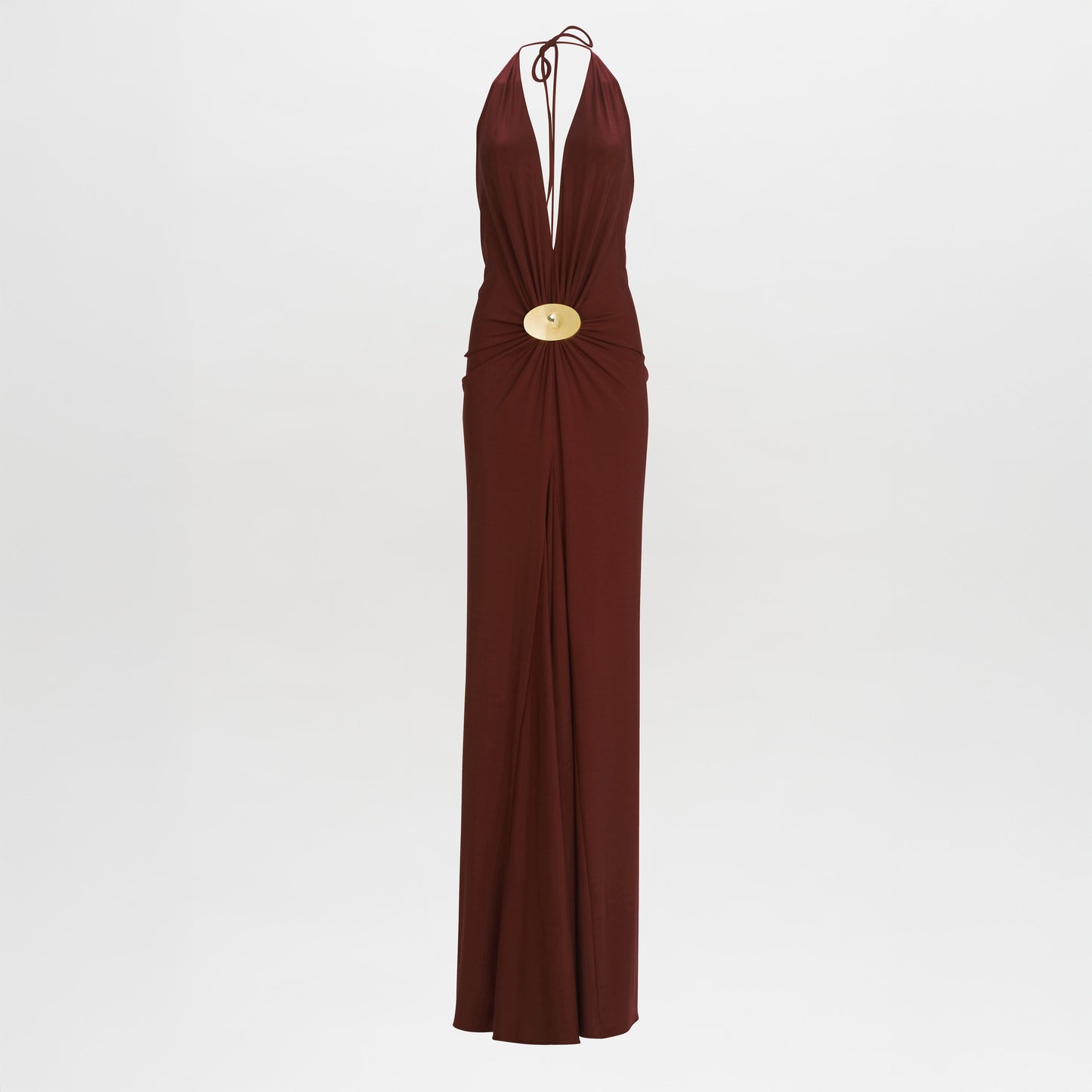 The Aiko Dress is a sleeveless, deep red halter-neck maxi with a plunging neckline, gold central embellishments, and a floor-length skirt.