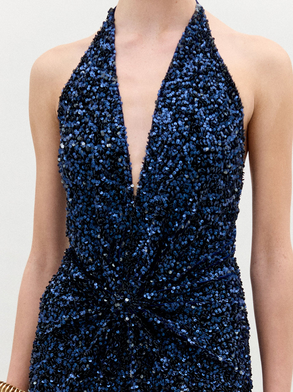 A woman wearing the Aiko Dress in color Navy on a white background.