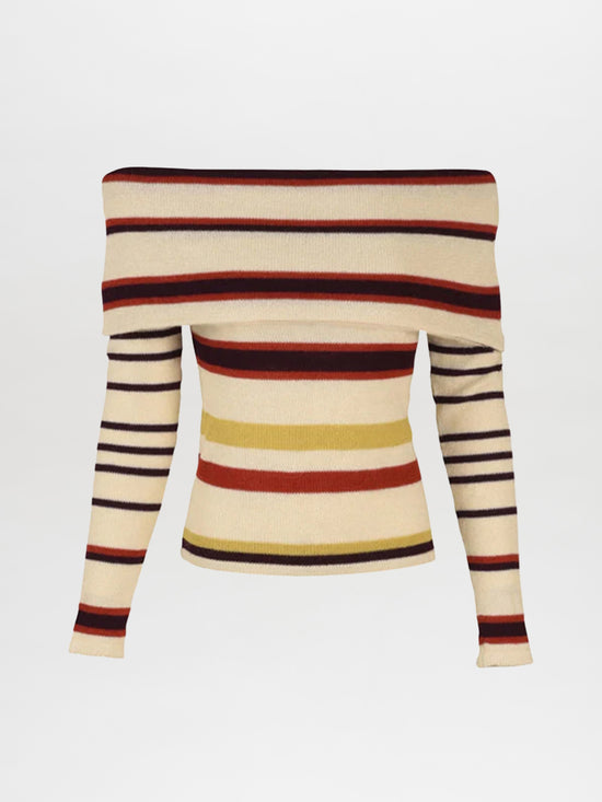 The Alexandra Knit Top by Silvia Tcherassi is a fitted, long-sleeved, off-the-shoulder sweater made from 100% baby alpaca. It features multi-colored stripes in black, red, beige, and yellow on a cream background with a wide neckline.