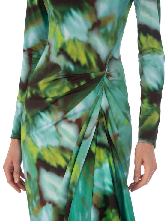 Ananya Dress Juniper Green with a green and blue abstract leaf pattern and asymmetrically draped skirt, isolated on a white background.