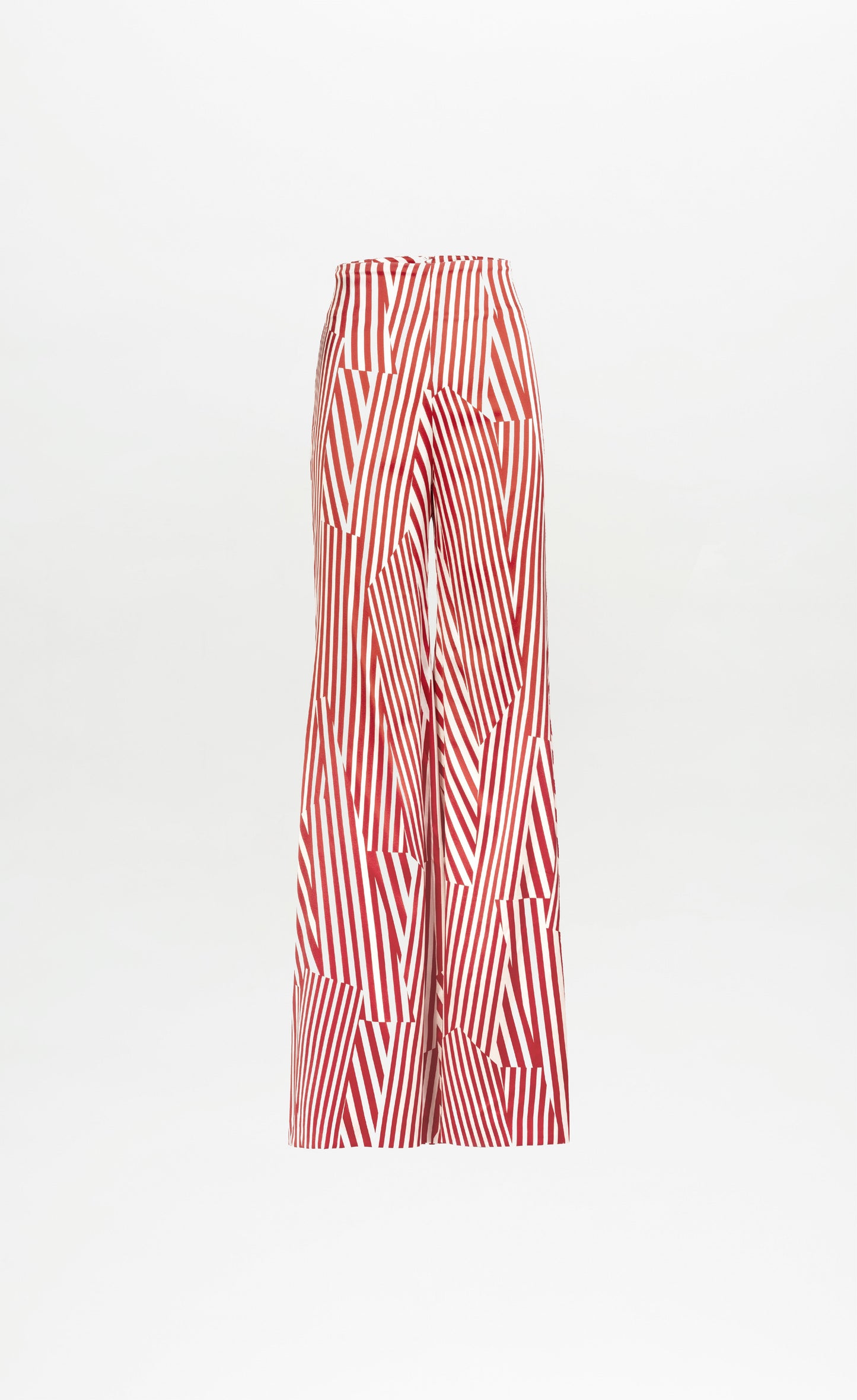 The Andie Pant by SVT DESIGNS is a wide-leg, high-waisted style made from Italian fabric, showcasing bold red and white geometric stripes on a crisp white background.