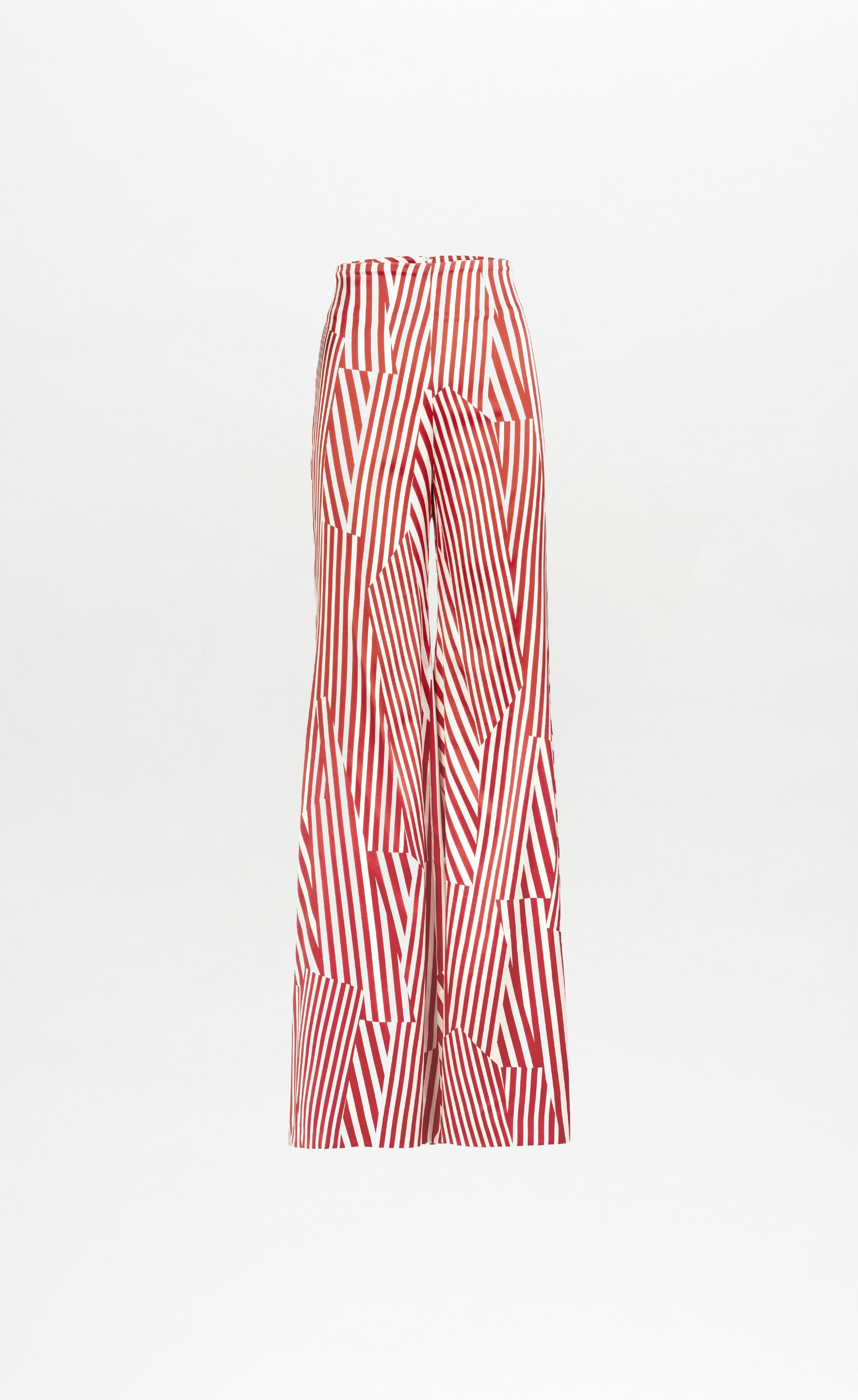 The Andie Pant by SVT DESIGNS is a wide-leg, high-waisted style made from Italian fabric, showcasing bold red and white geometric stripes on a crisp white background.