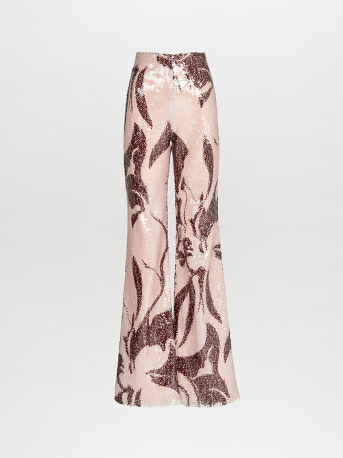 The Silvia Tcherassi Avellino Pant features glossy pink wide legs adorned with bold dark red floral sequins, showcased on a plain white background.