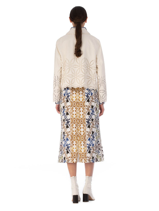 A white Belen Jacket Pearl with a high collar and decorative eyelet perforations on a plain background.