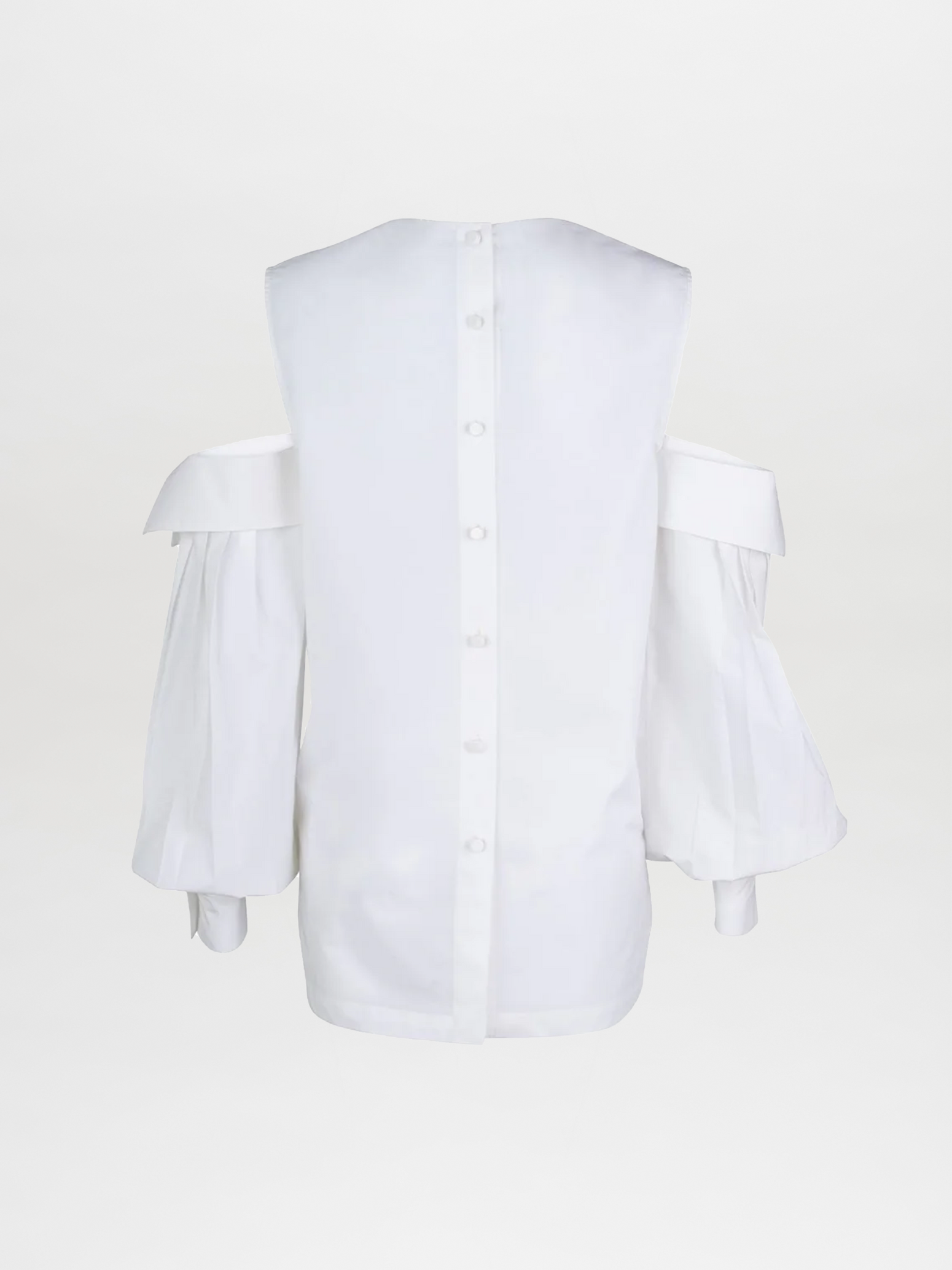 The Corato Shirt by SilviaTcherassiEU is an elegant white cotton blouse with off-the-shoulder design, button-down back detailing, a glossy finish, an oversized V neckline, and long puffed sleeves with cuffs.