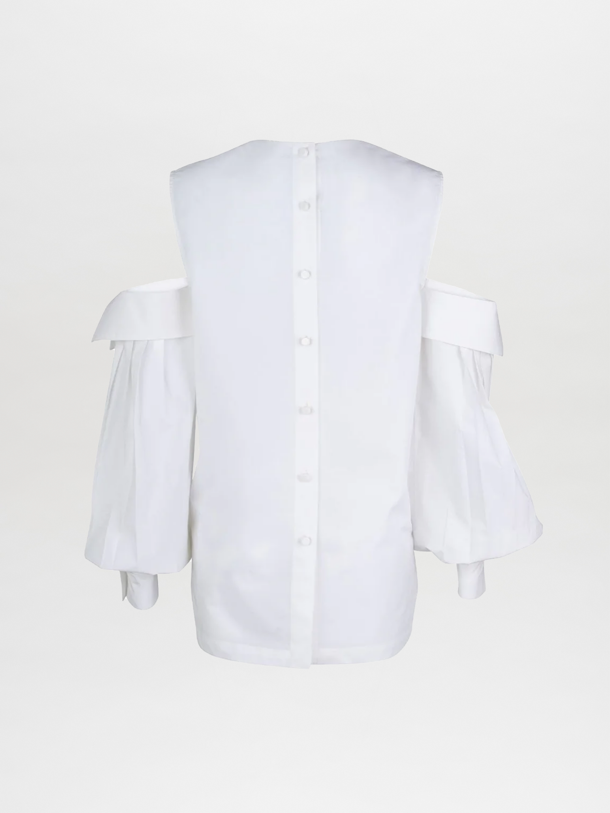 The Corato Shirt by SilviaTcherassiEU is an elegant white cotton blouse with off-the-shoulder design, button-down back detailing, a glossy finish, an oversized V neckline, and long puffed sleeves with cuffs.