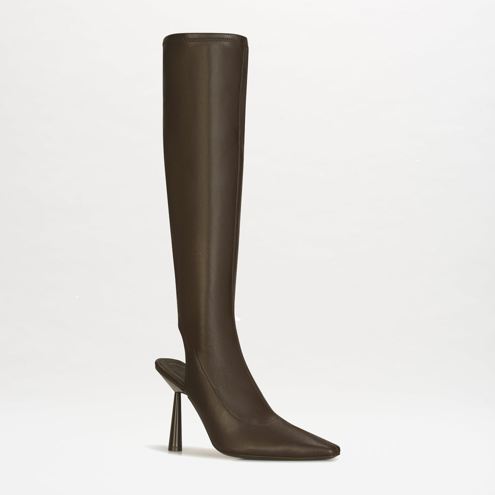 The Ember Boot by SVT DESIGNS is a brown Italian leather boot with a pointed toe, open back, and tall narrow heel, crafted in Italy and shown against a plain white background.