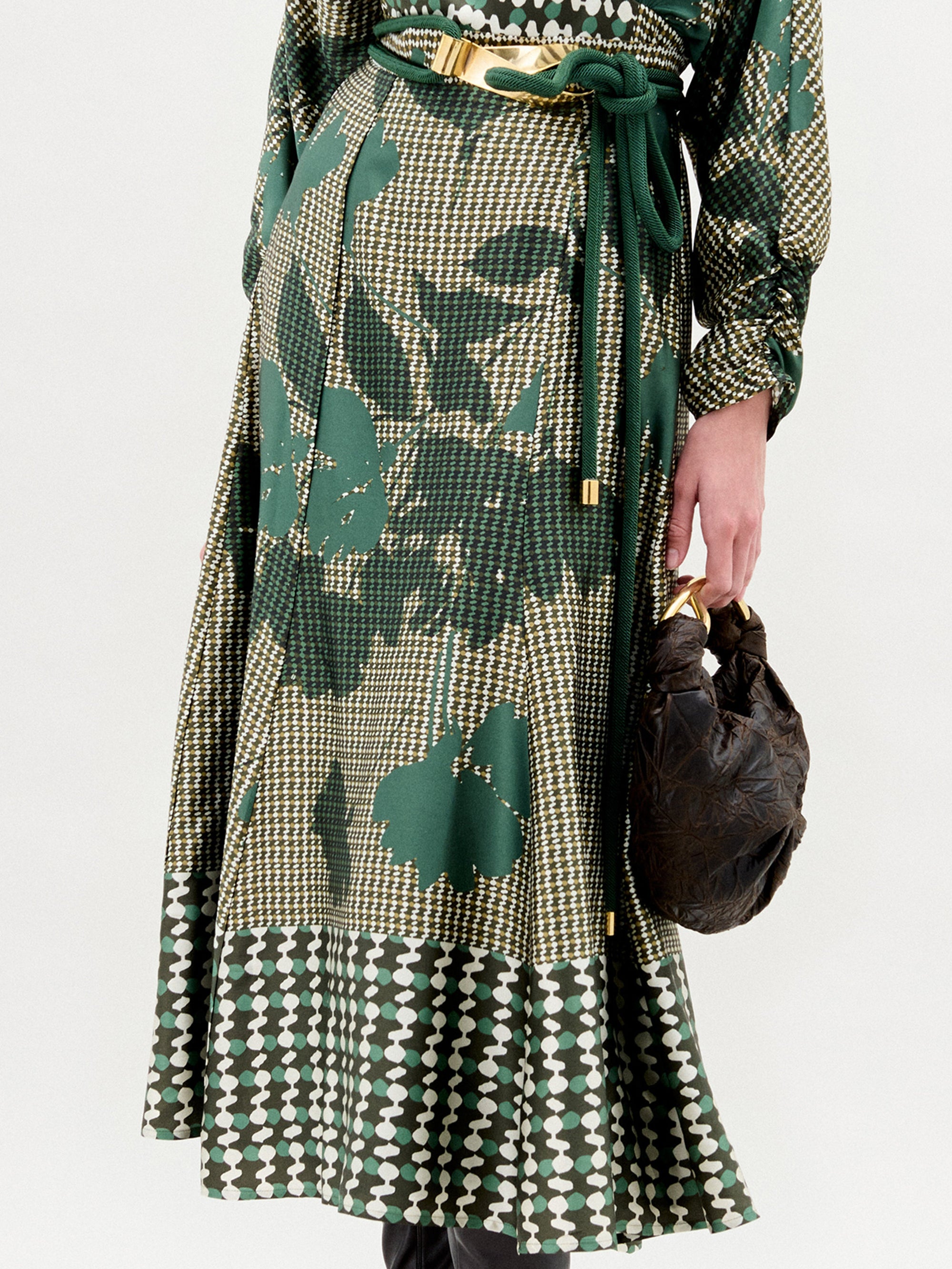 Green patterned coat with a white background