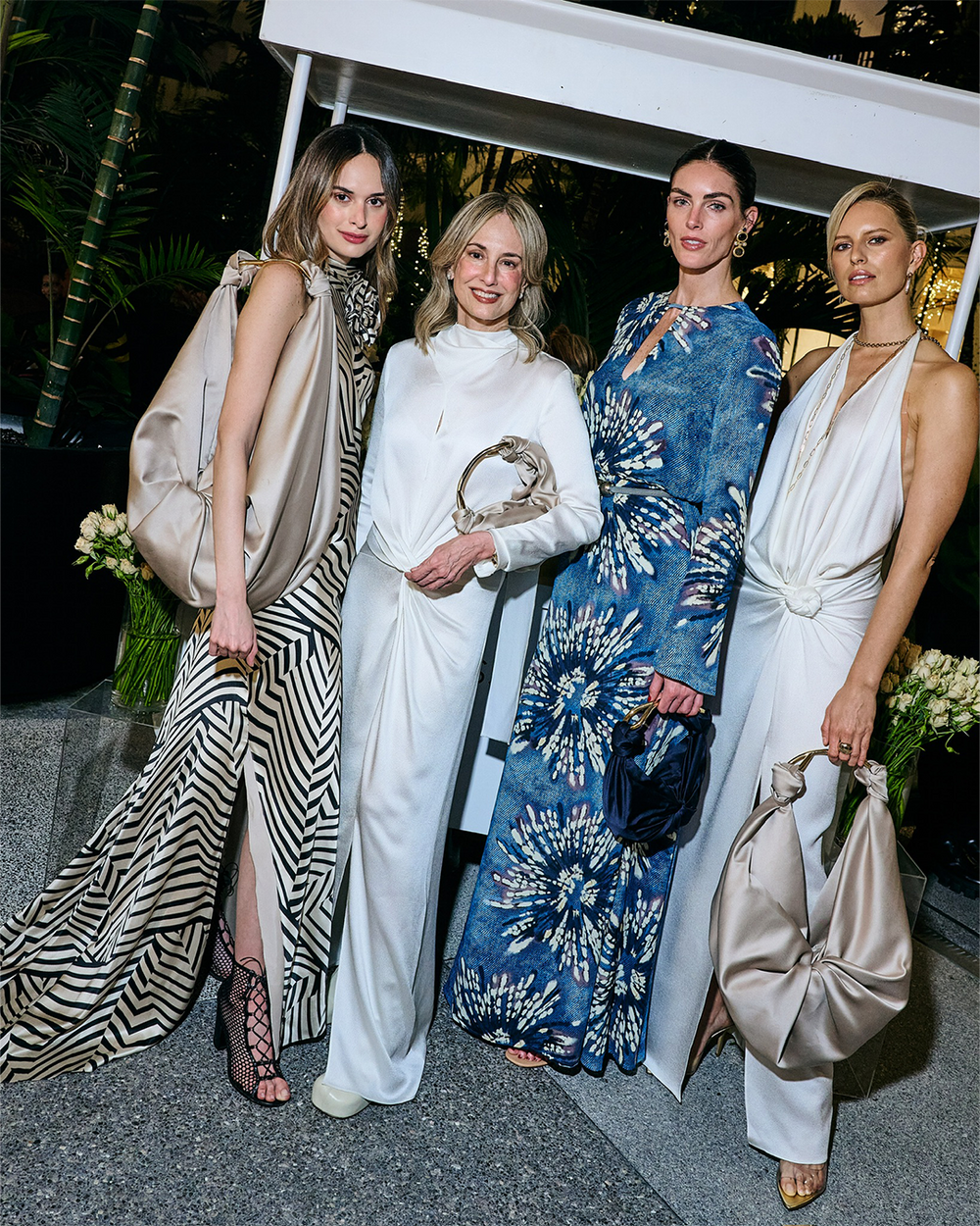 Four-women-in-elegant-dresses