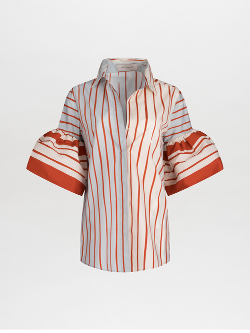 The Helina Blouse by SVT DESIGNS is a white and red striped cotton top with a classic shirt collar and button-down front. It has short, flared sleeves accented with red bands and multicolor vertical stripes of varying widths.