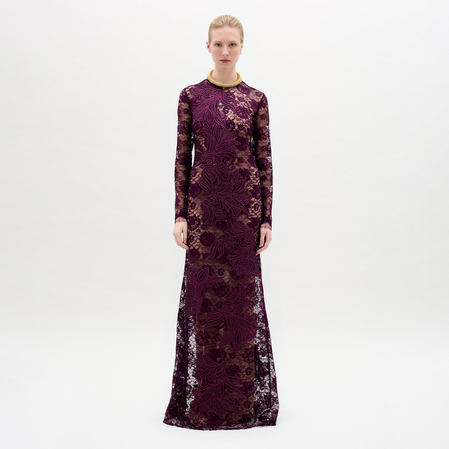 A woman wearing the Ida Dress in color Purple with a golden necklace on a white background.