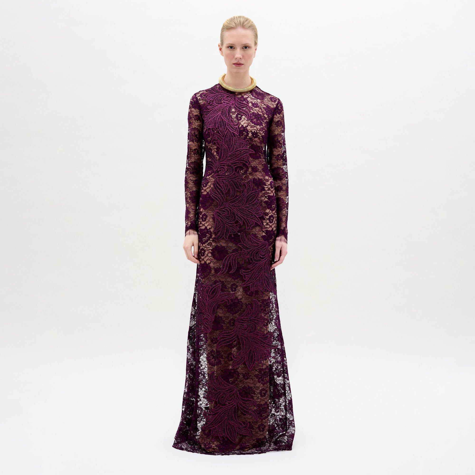 A woman wearing the Ida Dress in color Purple with a golden necklace on a white background.