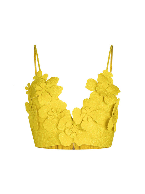 Ibbie Top Limoncello with spaghetti straps and 3D floral detailing, isolated on a white background.