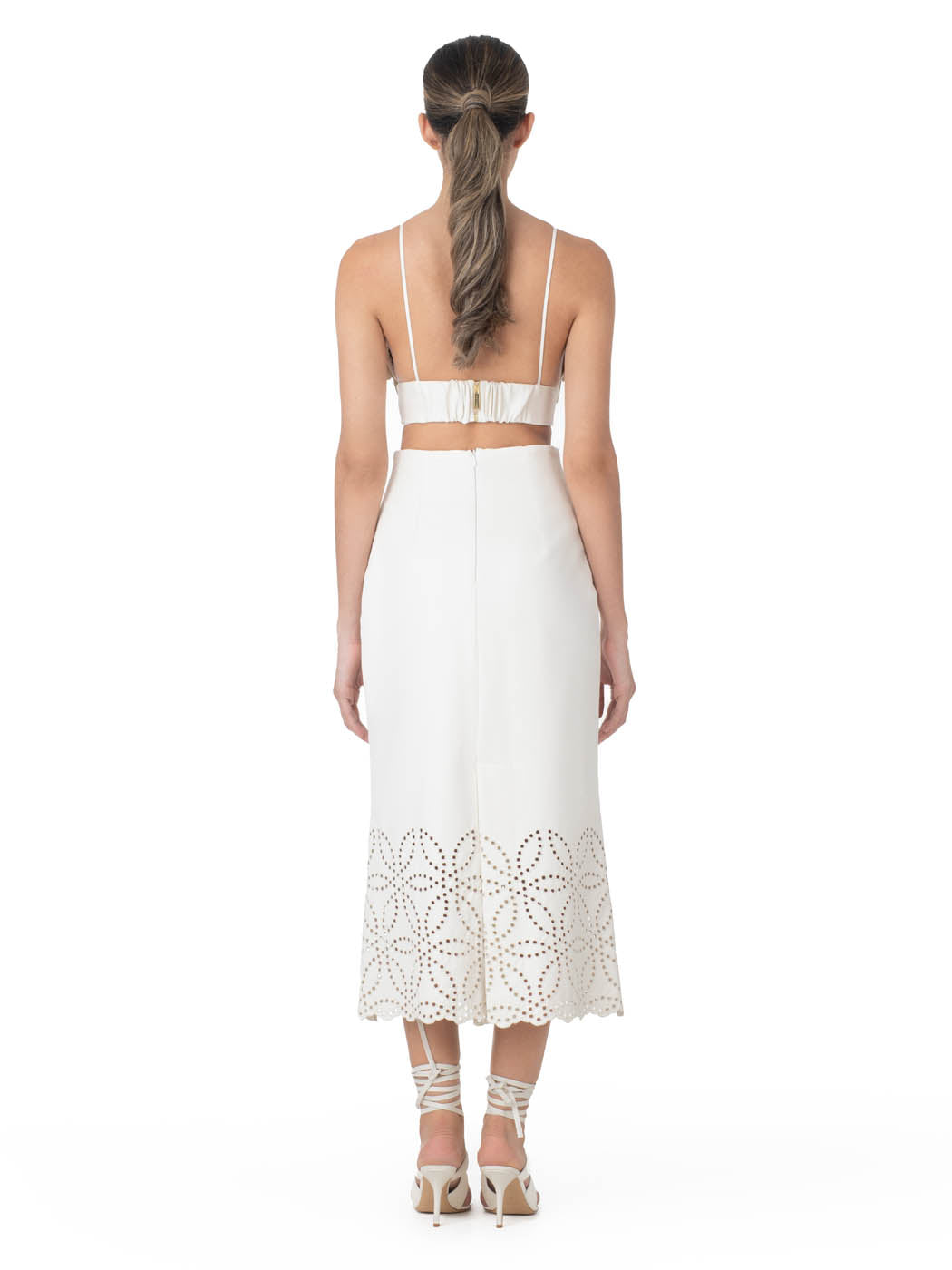 Atira Skirt Pearl high-waisted midi skirt with laser-cut floral hem design, isolated on a white background.