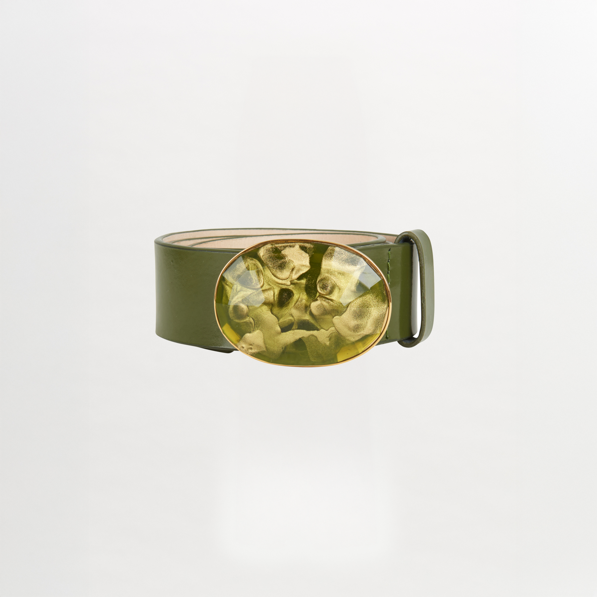 The Irene Belt Olive by Silvia Tcherassi is a standout Fall 2023 accessory—an Italian leather belt in olive green with a bold, marbled oval resin buckle, showcased against a plain white background.