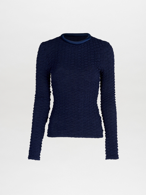 A women's long-sleeved Jari Top Navy, crafted from jacquard fabric, making it a versatile piece for Resort 2024.