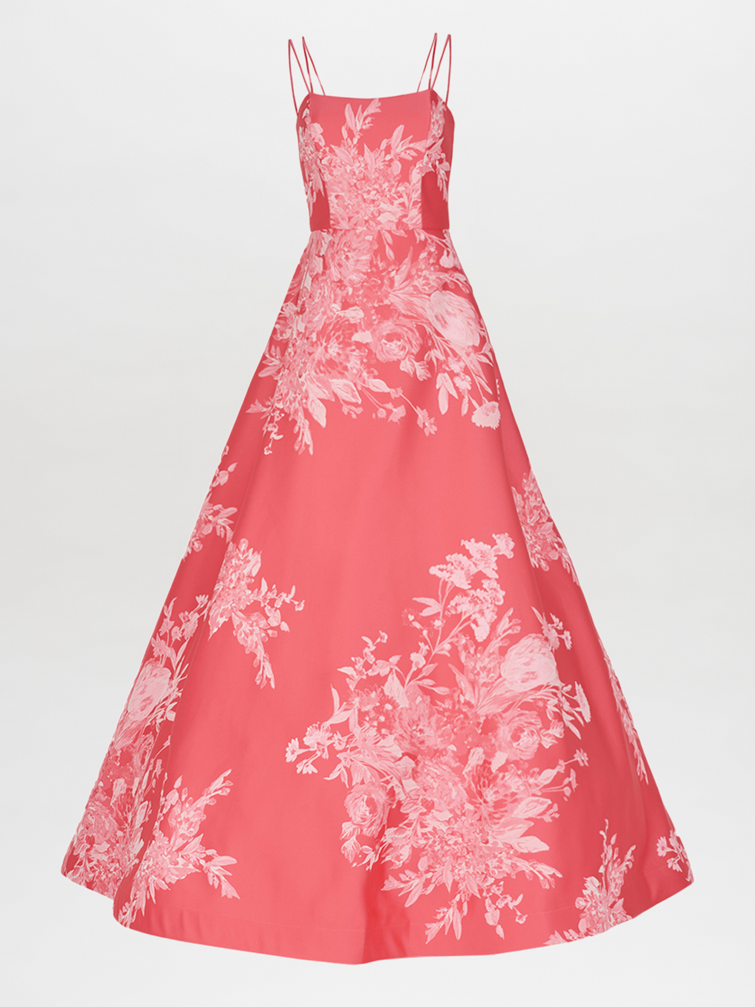 The Julene Dress Salmon Embroidered by Silvia Tcherassi is a floor-length evening gown featuring spaghetti straps, a fitted bodice, delicate salmon embroidery, and a white floral pattern that elegantly contrasts the vibrant pink fabric for a classic and sophisticated look.