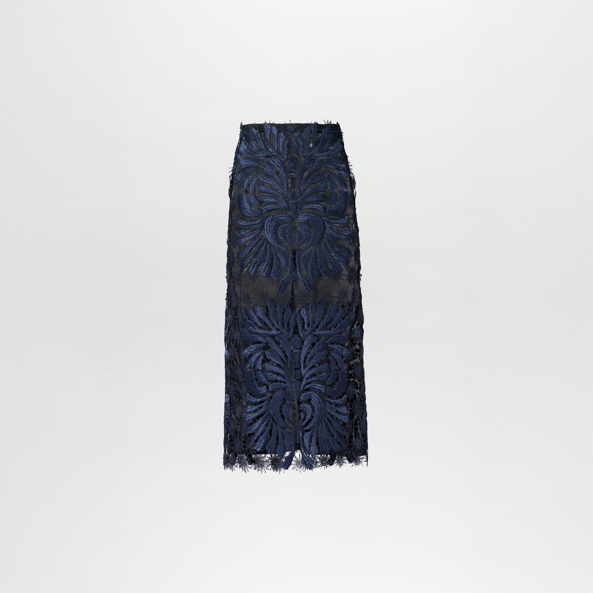 The Kin Skirt by SVT DESIGNS is a high-waisted midi skirt in navy lace with abstract floral details and a sheer mid-thigh panel, shown against a plain white background.