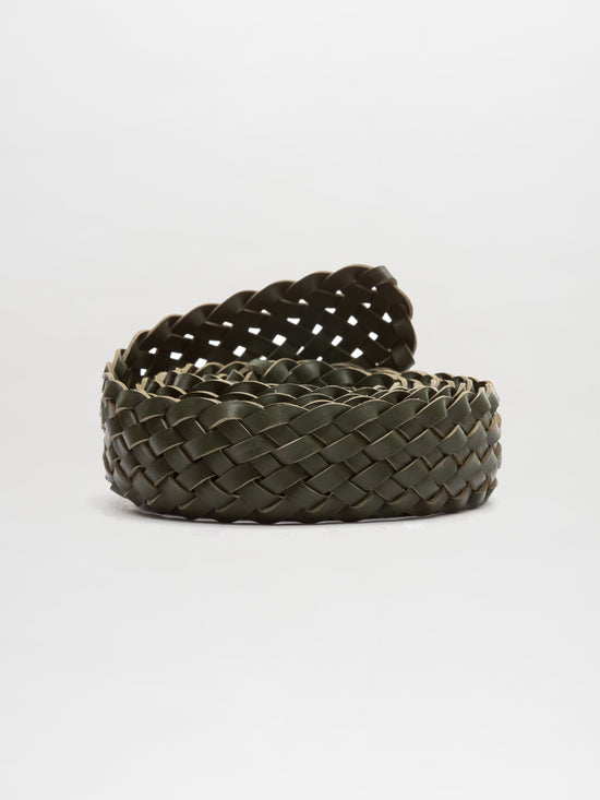 The Lauren Belt by SVT DESIGNS, made of intertwined Italian leather straps in a coiled, woven dark green design with an intricate texture and flat appearance, is featured against a plain white background.