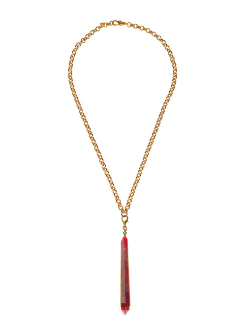 Introducing the Montse Necklace Rouge: a gold chain necklace featuring a long, red crystal pendant. Perfect for adding a touch of elegance to your look, this stunning piece will shine brightly on August 19th, 2024.