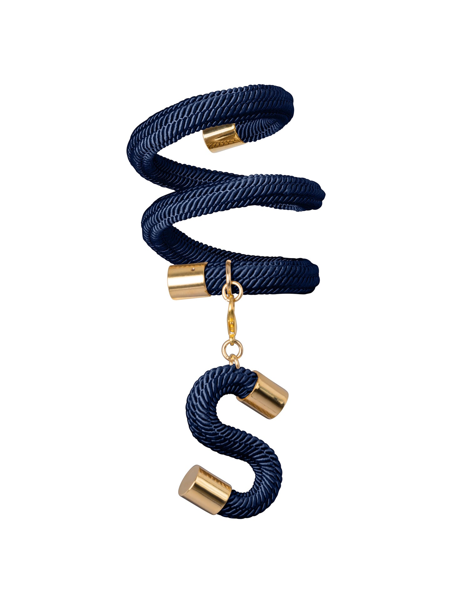 Introducing the Nicky Bracelet Navy, a coiled navy blue rope bracelet with gold accents and a dangling S charm, reminiscent of a maritime keepsake straight from a ship's deck.