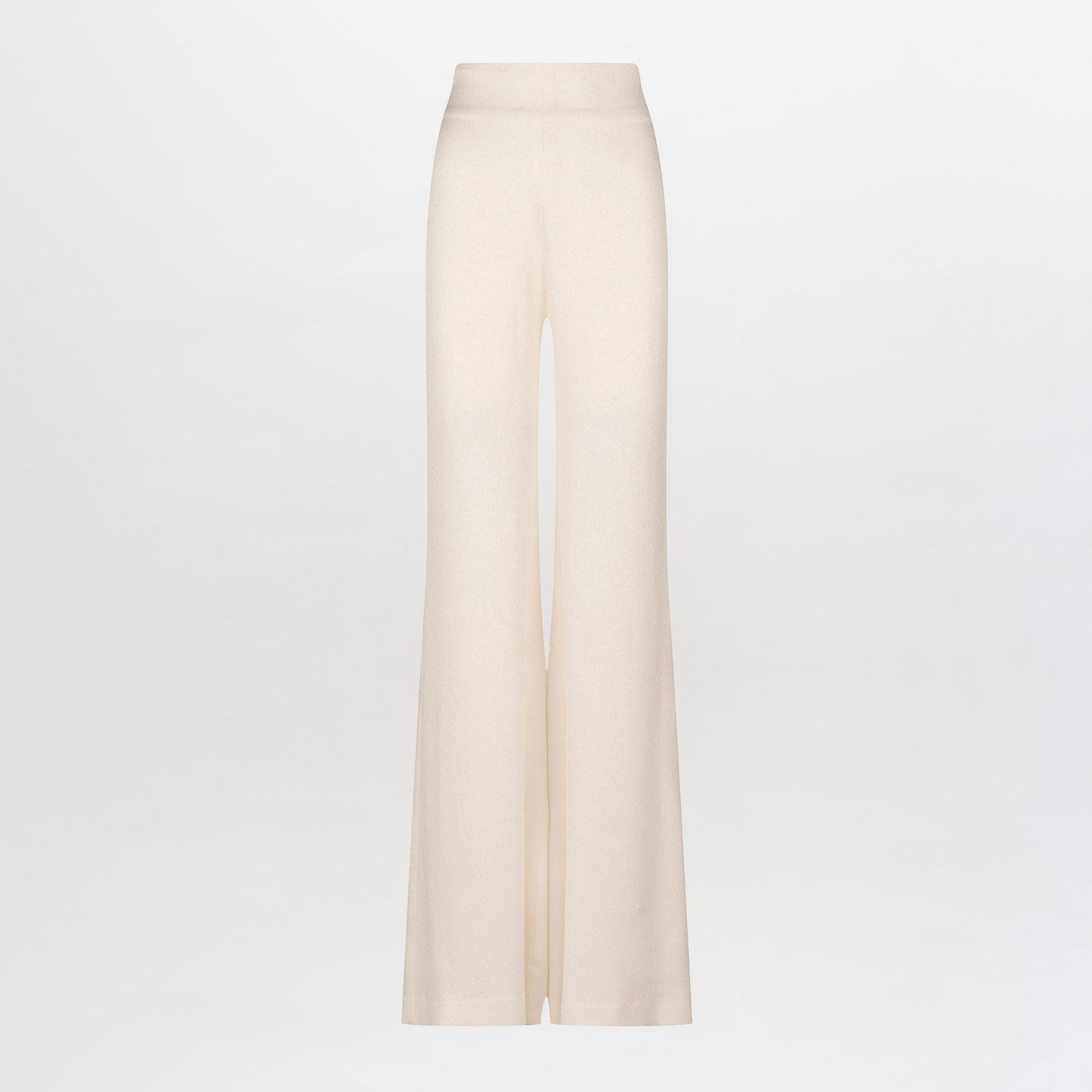 The Palermo Pant by SVT DESIGNS features wide-leg trousers in beige, showcasing a hammered texture and high waist on a plain white backdrop.