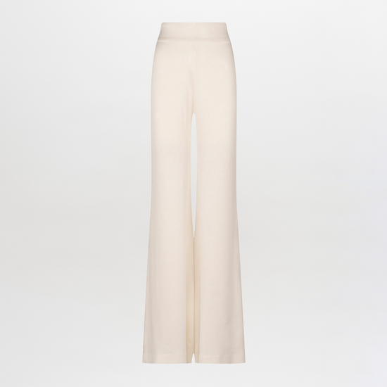 The Palermo Pant by SVT DESIGNS features wide-leg trousers in beige, showcasing a hammered texture and high waist on a plain white backdrop.