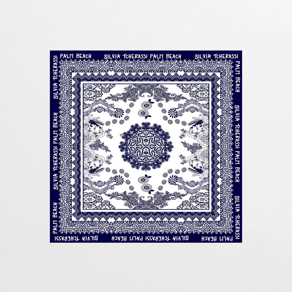 Navy blue scarf with white patterns and text on a white background