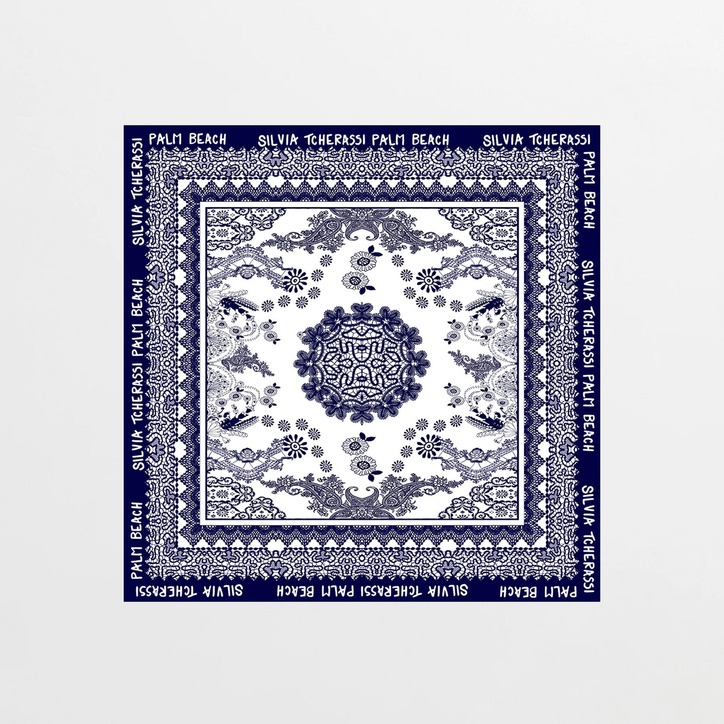 Navy blue scarf with white patterns and text on a white background