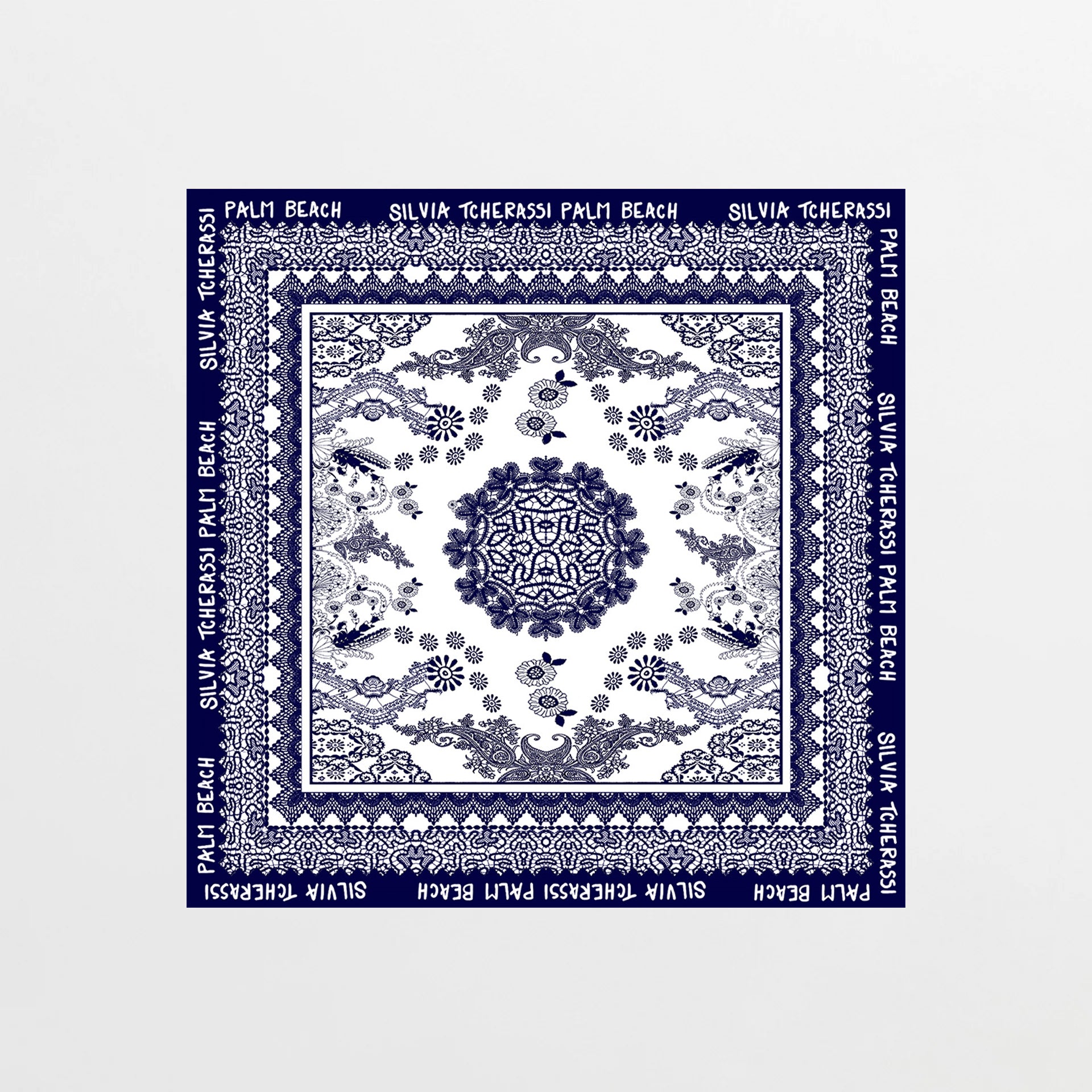 Navy blue scarf with white patterns and text on a white background