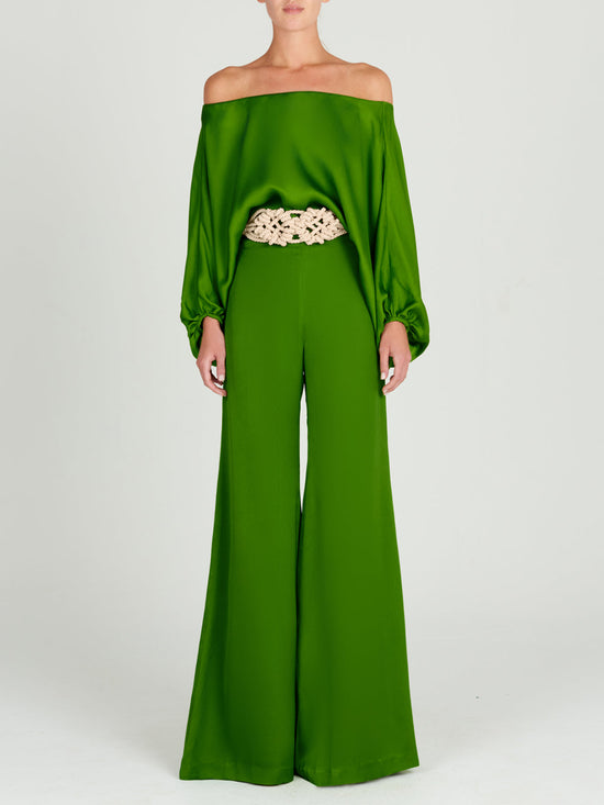 A Theresa Jumpsuit Lime with ruffled sleeves.